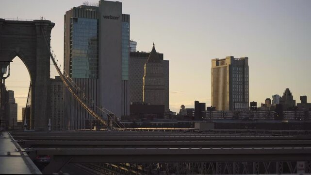 A detailed view of the Brooklyn Bridge and Manhattan Skyline at Sunset in New York