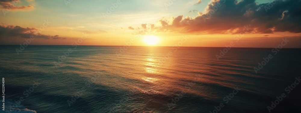 Aufkleber Drone view of tranquil ocean at sunset with colorful clouds and expansive sky ideal for text overlay or inspirational quotes