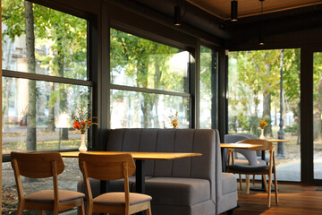 Stylish cafe with large windows. Interior design