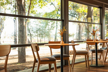 Stylish cafe with large windows. Interior design