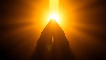 Silhouetted Hands Raised Towards Bright Sunlight