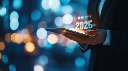 Tablet displaying 2025 with business professional holding it, symbolizing future trends, digital innovation, and technology in finance, investment, and strategic planning.