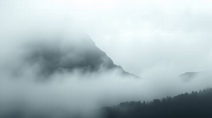 Fototapeta premium Serene Mountain Landscape in Foggy Atmosphere at Dawn