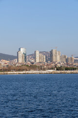 Skyline of Istanbul&rsquo;s Asian side with modern residential buildings and a rocky shoreline. A vibrant view of the Anatolian side blending urban development and coastal beauty. Panaromic Istanbul 2025