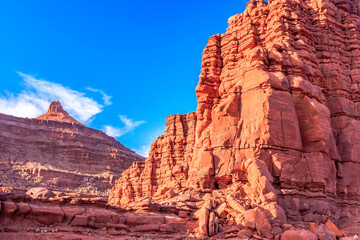 A rocky mountain range with a blue sky in the background