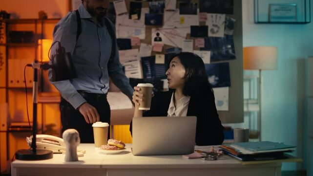 Detective brings coffee to a female colleague, brainstorming ideas for the case