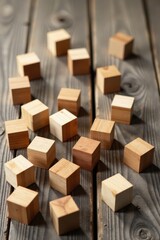 Scattered Wooden Cubes on Rustic Wood Surface A Study in Texture and Light