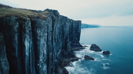 Majestic Cliffs meet the vast ocean under a serene sky, a breathtaking view of nature's beauty