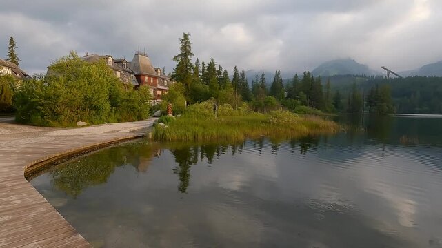 
Strbske pleso lake wth peaks on tha background in High Tatras mountains in Slovakia during sunrise with clouds