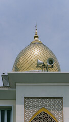Golden Mosque Dome with Islamic Architecture Detail