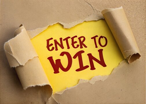 Enter to Win Message Written on Ripped Yellow Paper with Brown Background