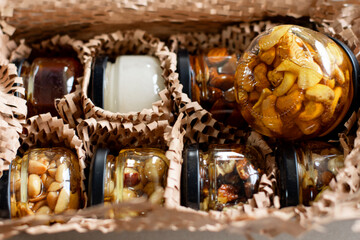 Photo of nuts with honey in jars