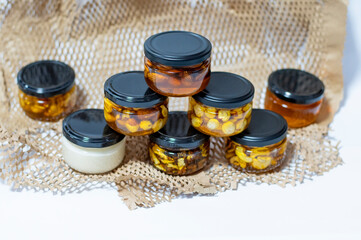 Photo of nuts with honey in jars