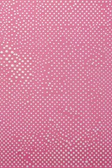 a close up of a pink and white polka dot pattern