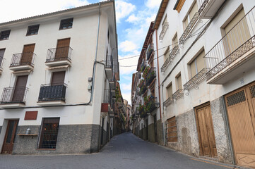 Quaint urban street with traditional windows and balcony details