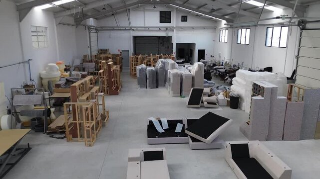 Inside the Sofa Factory: Aerial Drone Footage Showcasing Sewing Machines, Wooden Frames, and Fabrics in Action - Discover the Art of Upholstery and Craftsmanship from Above