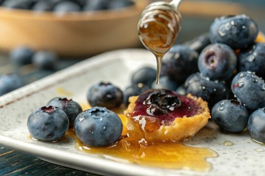 Close-up of a juicy bluberry being bitten into releasing a sweet and sticky honey center, bluberry, sweet, tasty, food