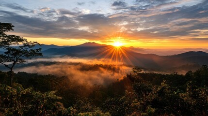 Serene Sunrise Over Mountain Landscape with Gentle Mist and Clouds