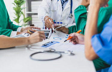 Medical team meeting analyzing blood test results in hospital laboratory. Doctors and scientists in...