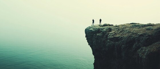 Two figures stand at the edge of a towering cliff overlooking an endless, misty sea, embodying...