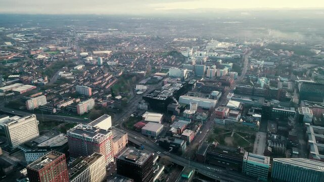 Aerial drone shot across Manchester shot from the west looking east at Deansgate Square, Manchester, UK