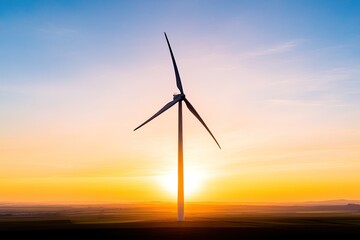 Fototapeta premium Majestic wind turbine silhouetted against a vibrant sunset over rolling hills, symbolizing renewable energy