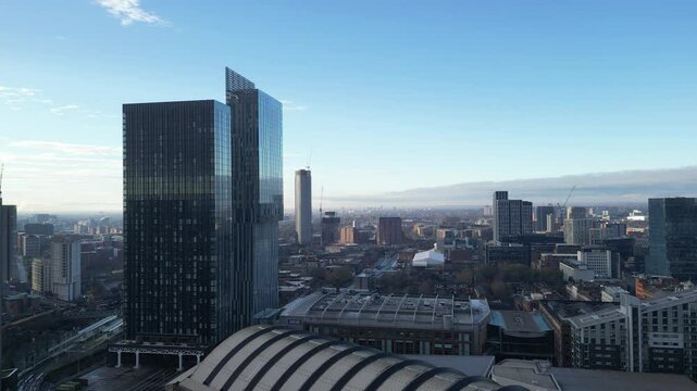 Aerial drone shot across Manchester shot from the west looking east at Deansgate Square, Manchester, UK