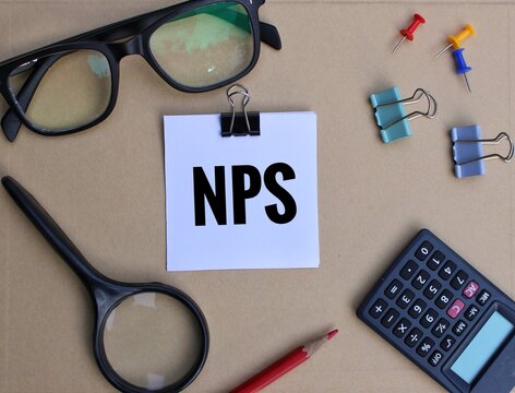 NPS or national pension scheme concept on open notepad with calculator.