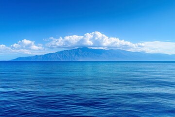 Serene Ocean View with Island and Blue Sky Under Soft Clouds
