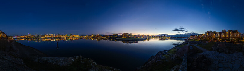Panoramic 360 Twilight Urban Waterfront View With City Lights Reflecting on the Water