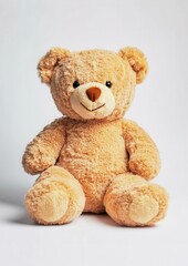 Obraz premium A cute, plush teddy bear with a warm smile, sitting upright and ready to be cuddled, perfect for children or as a comforting gift.
