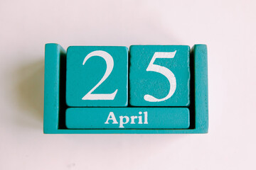 April 25. Blue cube calendar with month date isolated on white background.