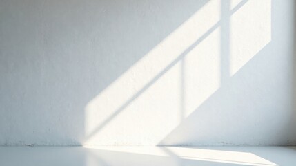 Obraz premium Light and Shadow Play on a White Wall in a Minimalist Room