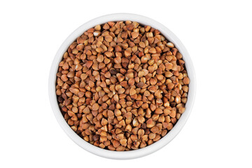 Raw buckwheat in ceramic bowl isolated on white background. Top view. Flat lay