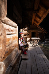 Woman in traditional costume. Ukrainian woman with a basket of apples. A young woman in a national Ukrainian costume. Embroidery. Ukrainian national clothing.