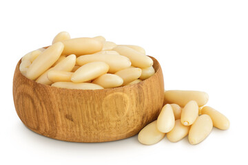 Shelled European pine nuts in wooden bowl isolated on white background with full depth of field