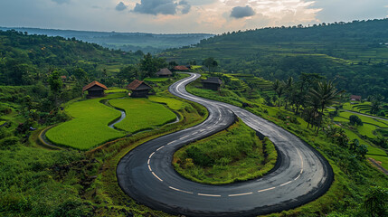 Fototapeta premium Serene Countryside Road Curving Through Lush Green Rice Fields