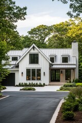 Modern white farmhouse with a sleek design surrounded by lush greenery in a peaceful neighborhood during the late afternoon