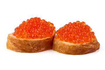 Red caviar on a crispy bread slice, isolated on white background.