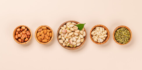 A vibrant assortment of various nuts, including almonds, walnuts, hazelnuts, cashews, and pistachios