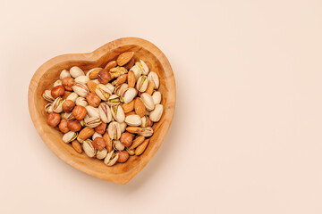 A vibrant mix of various nuts, including almonds, walnuts, hazelnuts, cashews, and pistachios