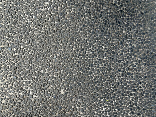 Close up of the texture of the asphalt road. Abstract background.