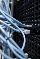 Cables pluged in network server. Optical connection, low-poly, with white tones