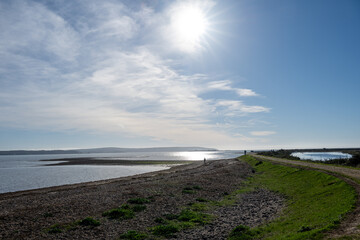 Footpath along The Solent Way trail at Lymington Hampshire England on a sunny winter day