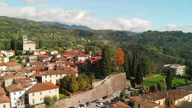 Beautiful aerial view of Barga, nestled in the Garfagnana valley, bathed in sunlight