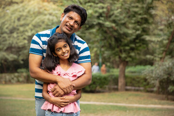Indian young happy  father hugging daughter. Father and daughter love. Happy fathers day 