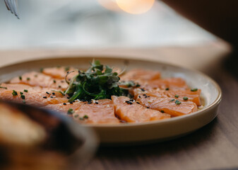 a plate of salmon sashimi