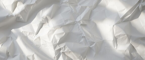 Obraz premium Crumpled white paper texture background with light shadows