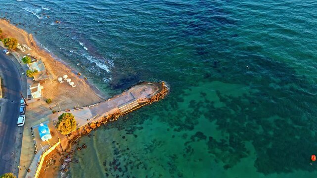 An&aacute;lipsi beach in chersonisos, greece, showcasing its serene coastline, aerial view