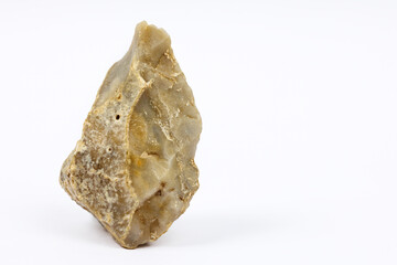 Prehistoric hand axe with natural textures isolated on a white background.